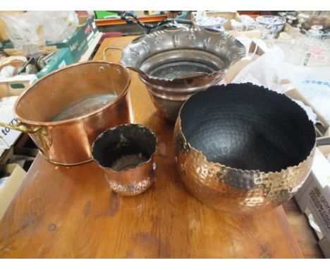 A COPPER TWIN HANDLED PLANTER' TOGETHER WITH THREE EMBOSSED COPPER VASES (4) 