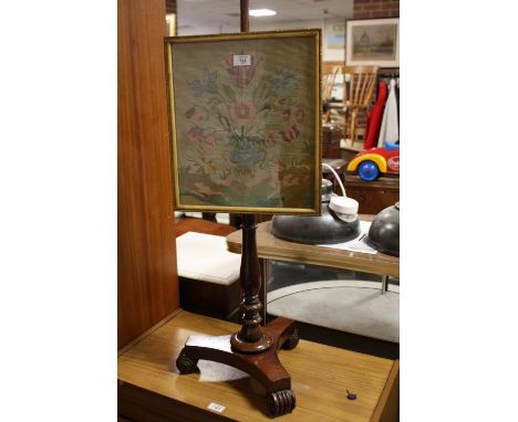 AN ANTIQUE MAHOGANY POLE SCREEN WITH LATER TAPESTRY SCREEN