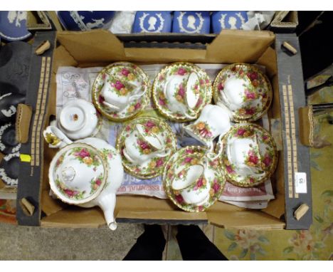 A ROYAL ALBERT OLD COUNTRY ROSES TEAPOT AND SIX TRIOS
