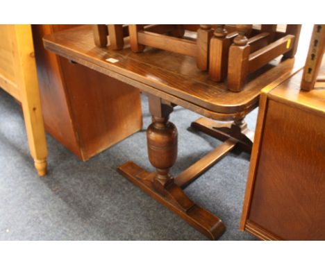 A VINTAGE OAK DRAWLEAF DINING TABLE