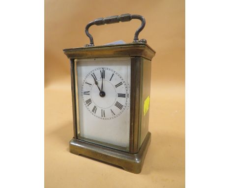 AN ANTIQUE FRENCH BRASS CARRIAGE CLOCK