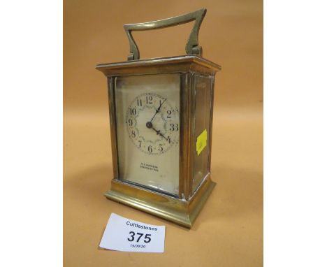 AN ANTIQUE FRENCH BRASS CARRIAGE CLOCK