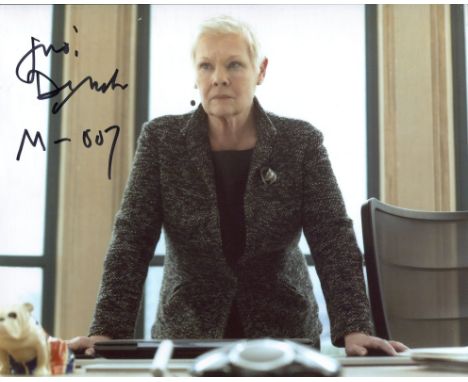 007 James Bond 8x10 movie photo signed by Dame Judi Dench who has added 'M' to her signature. Good condition. All autographs 