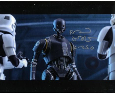 Star Wars 8x10 photo signed by Alan Tudyk as K 2SO. Good condition. All autographs come with a Certificate of Authenticity. W