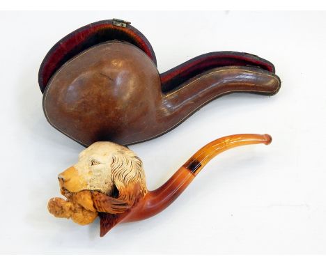 Meerschaum and amber pipe, the bowl carved with hunting dog holding game, cased 