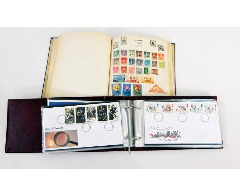 Blue album of world stamps and two albums of Royal Mail first day covers 