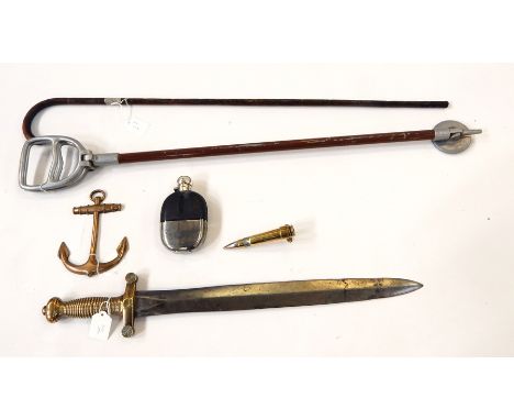 A hip flask, brass anchor, a brass shell, swagger stick, shooting stick and a sword 