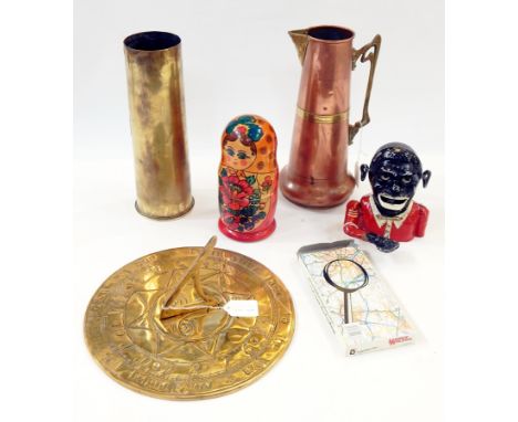 Large and small ammunition shells, a brass sundial, magnifying glass, Russian doll, a copper water holder and a reproduction 