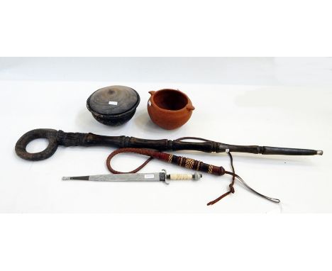 African carved hardwood walking stick with mask and loop handle, African dagger, leather whip, covered pot and a Cypriot terr