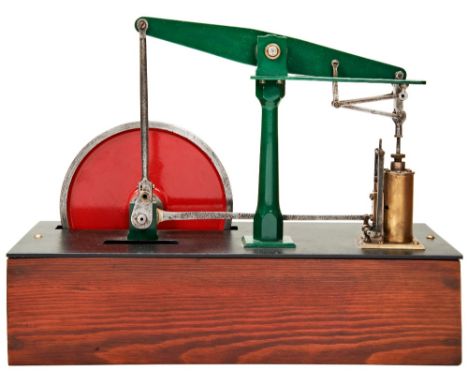 A SIMPLE ENGINEERED BEAM PUMPING ENGINE&nbsp;with solid flywheel, mounted on a wooden box base.  34 cms long max  PROVENANCE: