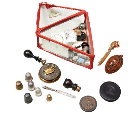 A VICTORIAN COQUILLA NUT POMANDA/SEWING CASE&nbsp;various silver thimbles, a hunting dog whist marker, various coins, medalli