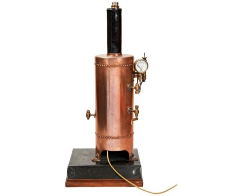 A FREE STANDING VERTICAL COPPER STEAM BOILER&nbsp;on a folded sheet metal base, with black lacquered chimney and a Schaeffer 