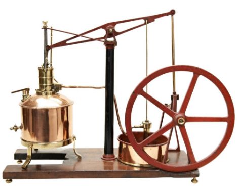 AN ENGINEERED MODEL OF A BEAM PUMPING ENGINE&nbsp;with copper and brass boiler and pumping pond mounted on a wooden base. 46 
