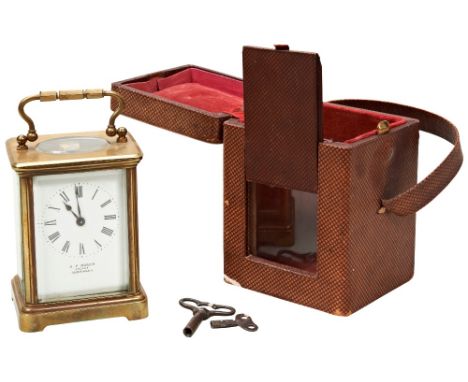 A FOUR GLASS BRASS CARRIAGE CLOCK C1900&nbsp;the dial with retailers mark for A.P. Roger ARCADE Guernsey, with maroon morocco