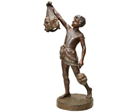 AFTER JEAN LOUIS GREGOIRE: PATINATED SPELTER LAMP IN THE FORM OF A BOY WITH HEADS OF DEFEATED FOES, early 20th century 56 cms