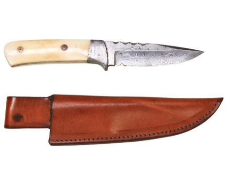 A MAAN DAMASCUS STEEL HUNTING KNIFE WITH MARINE IVORY HANDLE and leather sheath. 23.5 cms long  Note: These bladed products a