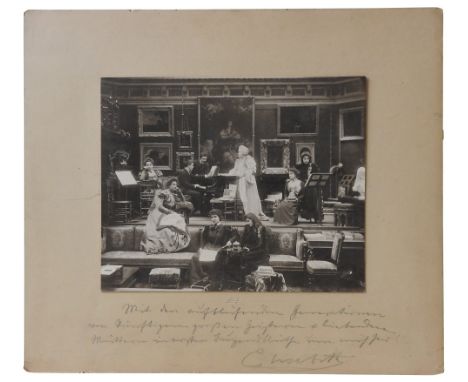 QUEEN ELISABETH OF ROMANIA, A FAMILY GROUP PHOTOGRAPHIC PORTRAIT&nbsp;the Queen centrally posed in a sumptuous room next to a