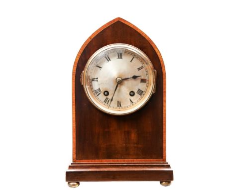 AN EDWARDIAN GEORGE III STYLE ARCHED TOP MAHOGANY MANTEL CLOCK&nbsp;with slivered dial. 27 cms high  PROVENANCE: The David St