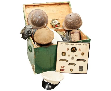 A QUANTITY OF MILITARIA&nbsp;including a relic condition American WWII helmet, a German WWII canister gas mask, various unifo