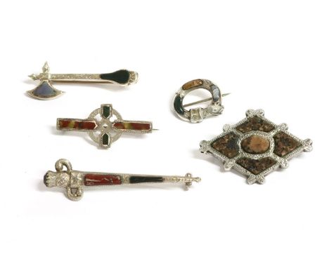 Six assorted Scottish hardstone or pebble brooches, to include:a silver Scottish axe set with a blue chalcedony and blood aga