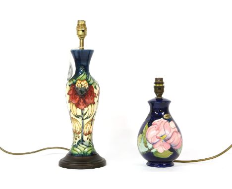 Two Moorcroft lamp bases, one mounted on a plinth, 42cm and 25 cm high (2)