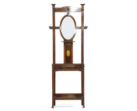 An Edwardian inlaid mahogany hallstand, having central mirror above glove box flanked to either side by stick studs, 60cm x 2