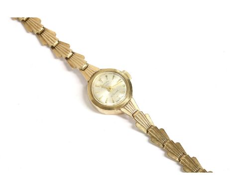A ladies 9ct gold Rotary mechanical bracelet watch, silvered dial with baton numerals and integral shell link bracelet, 11.95