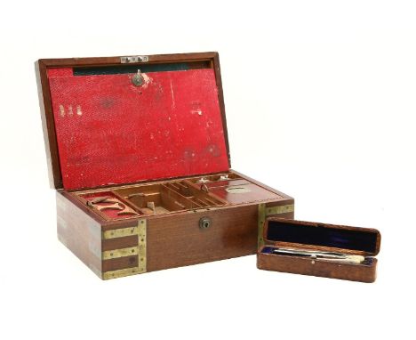 A Victorian mahogany travelling toiletry box, with brass banding and recessed handles, the fitted interior with a lift out tr