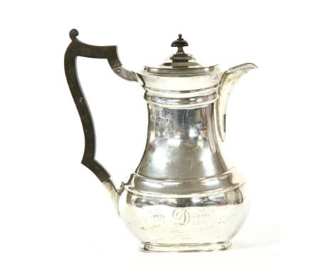 A silver chocolate pot of rounded rectangular form, on plinth base with hardwood handle and finial, by R &amp; W Sorley, Lond