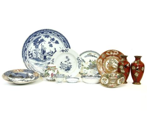 A Chinese blue and white charger, 19th century, with figures beneath a tree, another smaller dish, with punus, a Kutani dish,