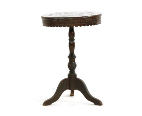 An Eastern hardwood and mother of pearl inlaid occasional table, with circular top and tripod base, 43cm diameter, 61cm high