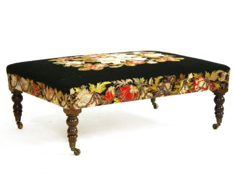 A large embroidered stool, standing on turned legs, width 98cm