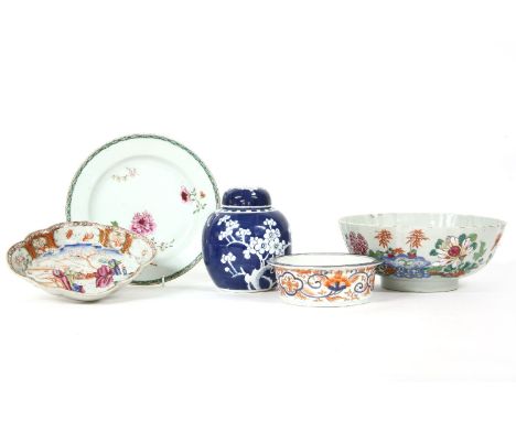 A Chinese famille rose punch bowl, 18th century, painted with flowers, a plate similarly decorated, a Canton enamelled quatre