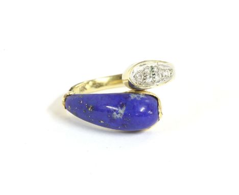 A gold diamond and Lapis Lazuli crossover ring, marked 14k, size K½, 4.22g