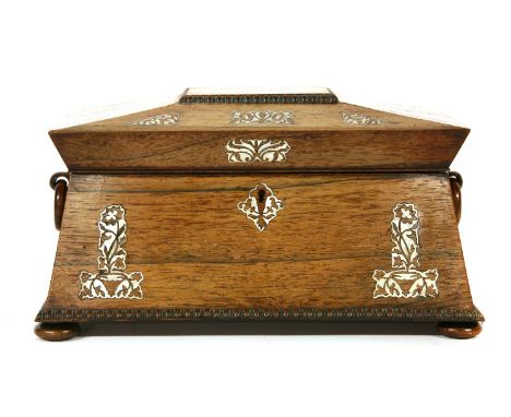 A Regency rosewood and mother of pearl inlaid tea caddy, with a glass mixing bowl, and  flanked with lidded compartments, 35c