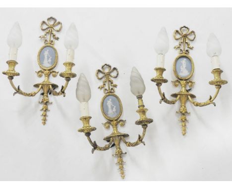 A set of three gilt metal twin branch wall light, inset with jasperware plaque, 46cm high