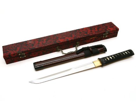 A replica Japanese tanto and scabbard