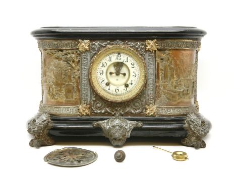 A late 19th century Ansonia mantle clock, with enamelled dial between copper panels with relief classical decoration a/f