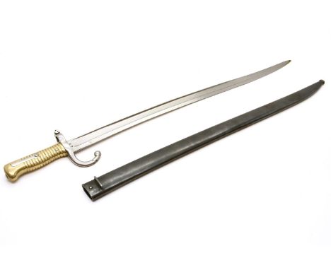 A French Chassepot bayonet and scabbard, inscribed ' Mre D'Armes de Chat Janvier 1872. 71cm long