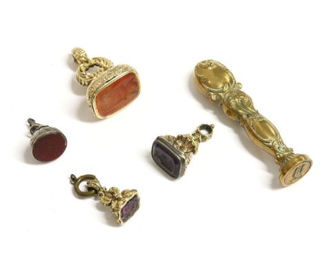 A collection of assorted seals, to include a large gold cased Cornelian intaglio seal, two gold cased amethyst seals, a gilt 