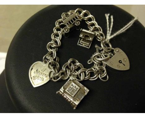 Silver double linked charm bracelet with padlock clasp, hallmarked London 1978 and safety chain, maker RGS. Has 4 charms incl