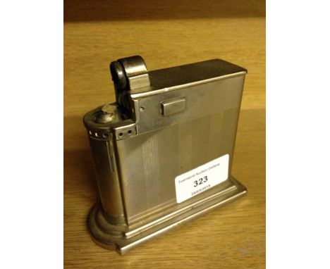 A large Deco style Rowenta table lighter with engine turned decoration.