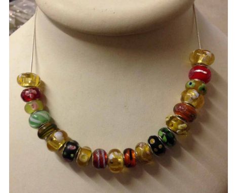 20 Murana glass beads with silver sleeves marked 925, various designs & colours, on a silver chain.