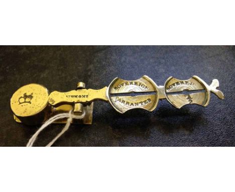Vintage sovereign & half sovereign weighing scales by Simmons.