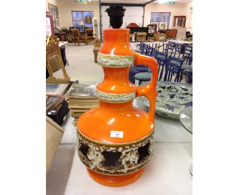 A large West german style orange Fat Lava studio pottery lamp. 55cm tall.