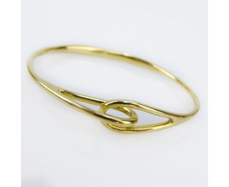 Tiffany & Co 18 Karat Yellow Gold Bangle Bracelet. Stamped. Slightly out of round otherwise good condition. Measures 2-3/8" i