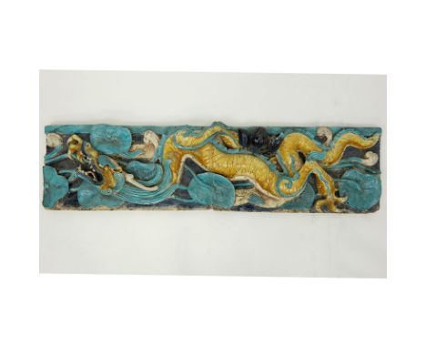 Chinese Ming Dynasty Glazed Pottery Architectural Relief Plaque. Unsigned. Losses, wear. Measures 45-1/2" x 11-1/2". Shipping