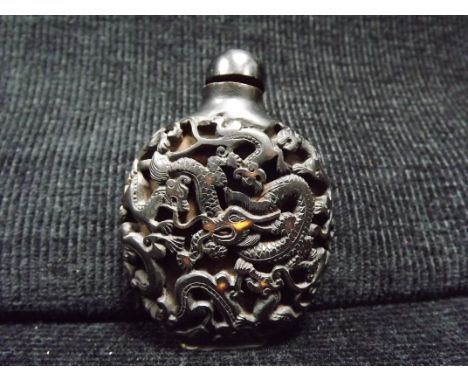 Chinese Eight Dragon Snuff Bottle. Unusual, made of light coloured possibly ceramic type material with a brown outer coloured