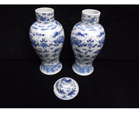2 x Chinese Blue and White lidded Vases. Qing Dynasty - Kangxi 4 character mark but 20th century. Imperial 5 Claw Dragons cha