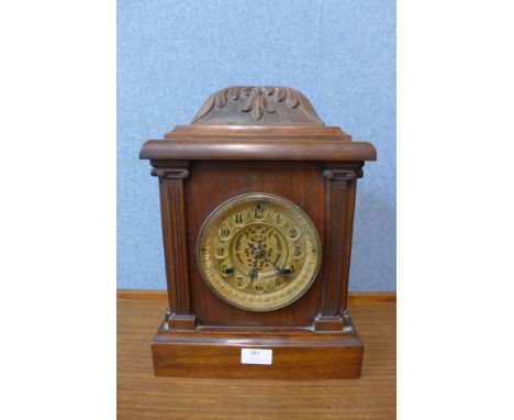 A 19th Century American Waterbury Clock Co. oak bracket clock 